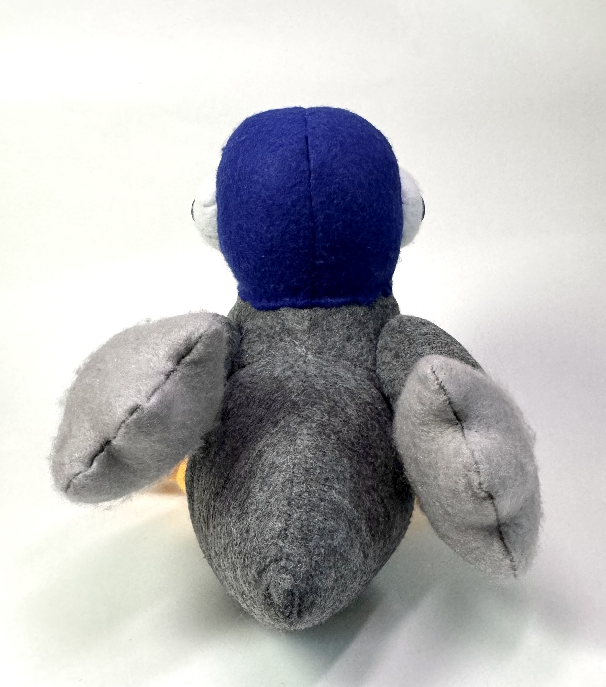 Back view of the Pippin the Pigeon stuffed animal