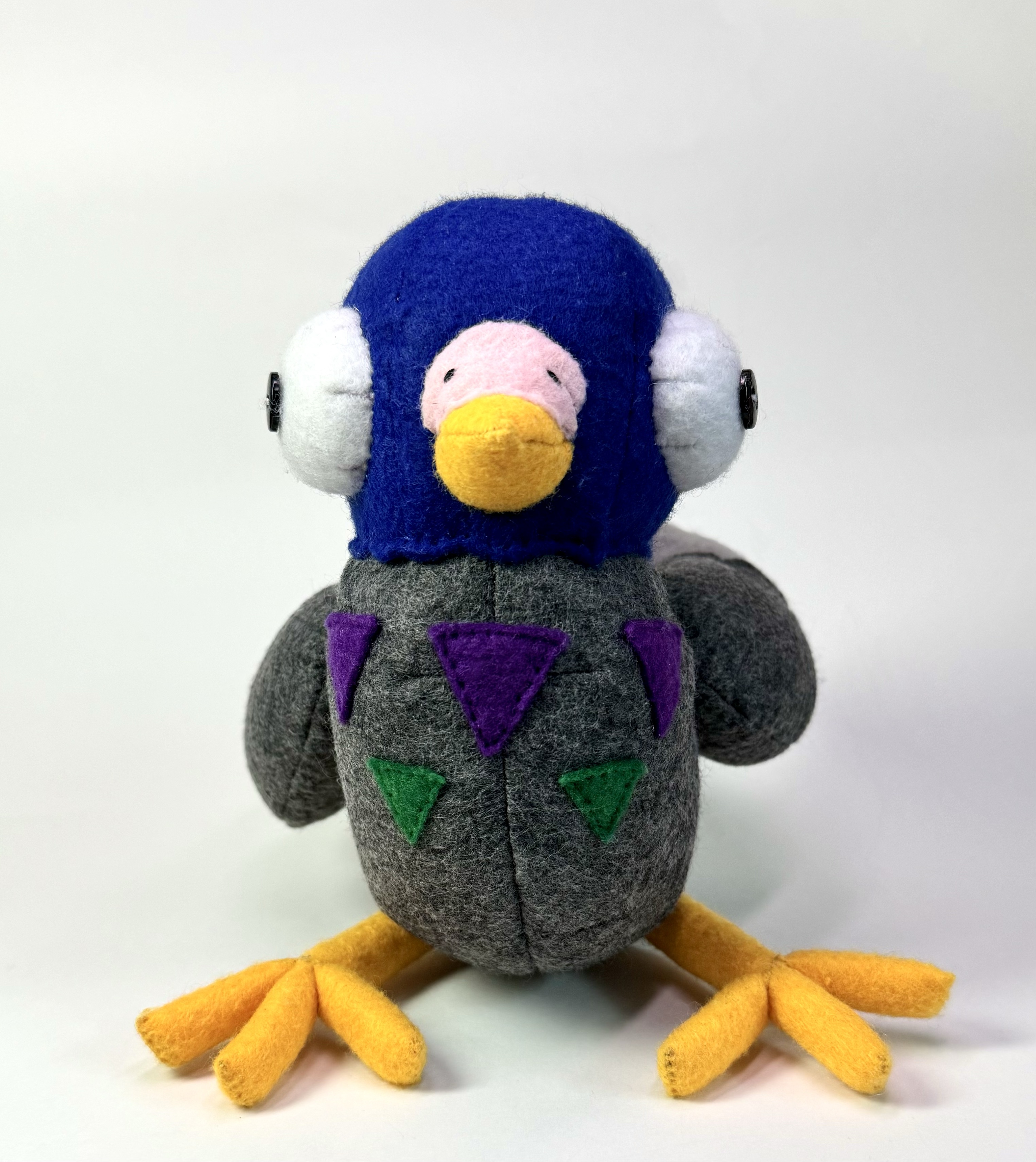 Front view of the Pippin the Pigeon stuffed animal