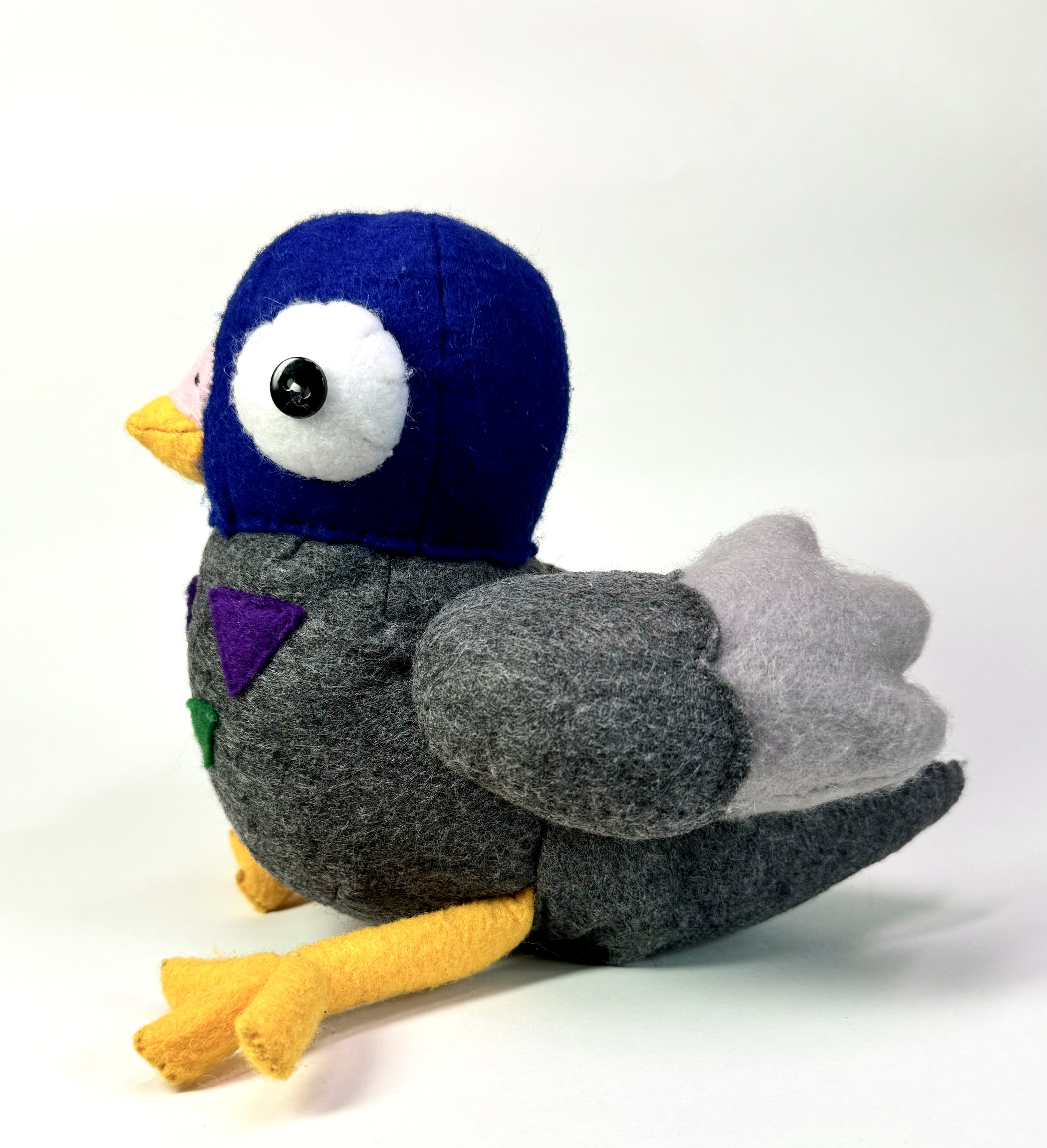 Left view of the Pippin the Pigeon stuffed animal