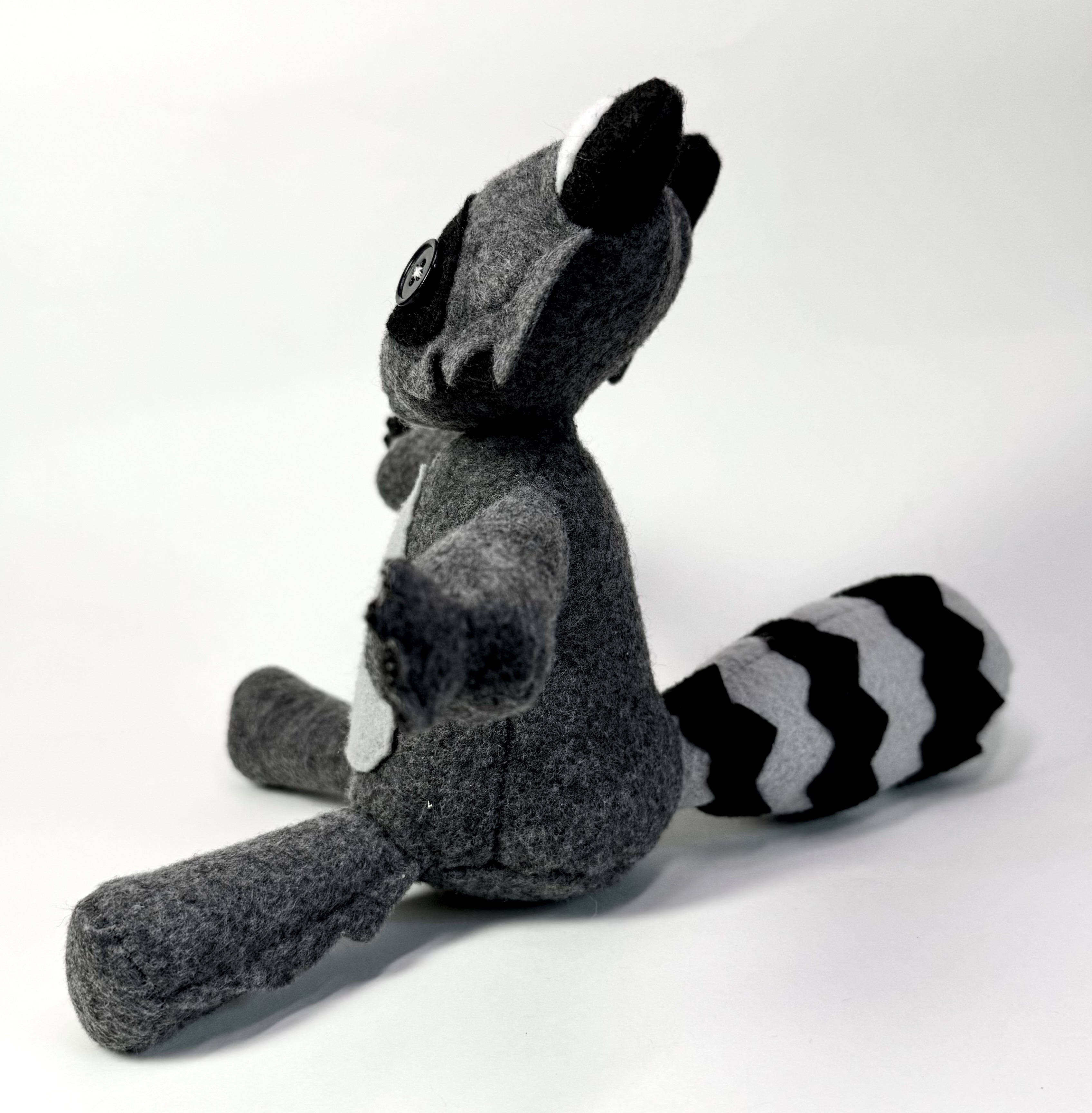 Left view of the Ringo the Raccoon stuffed animal
