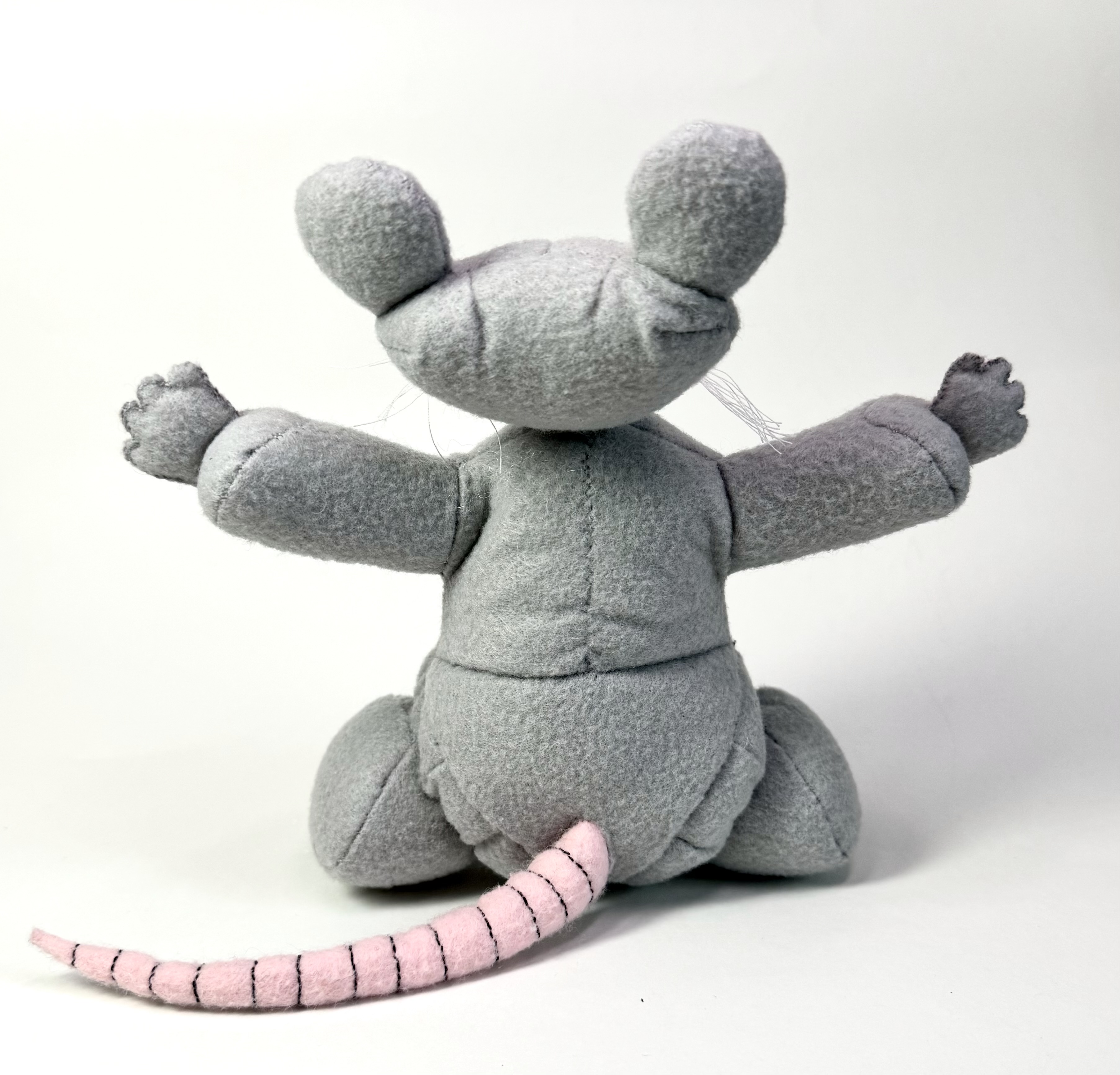 Back view of the Riggs the Rat stuffed animal
