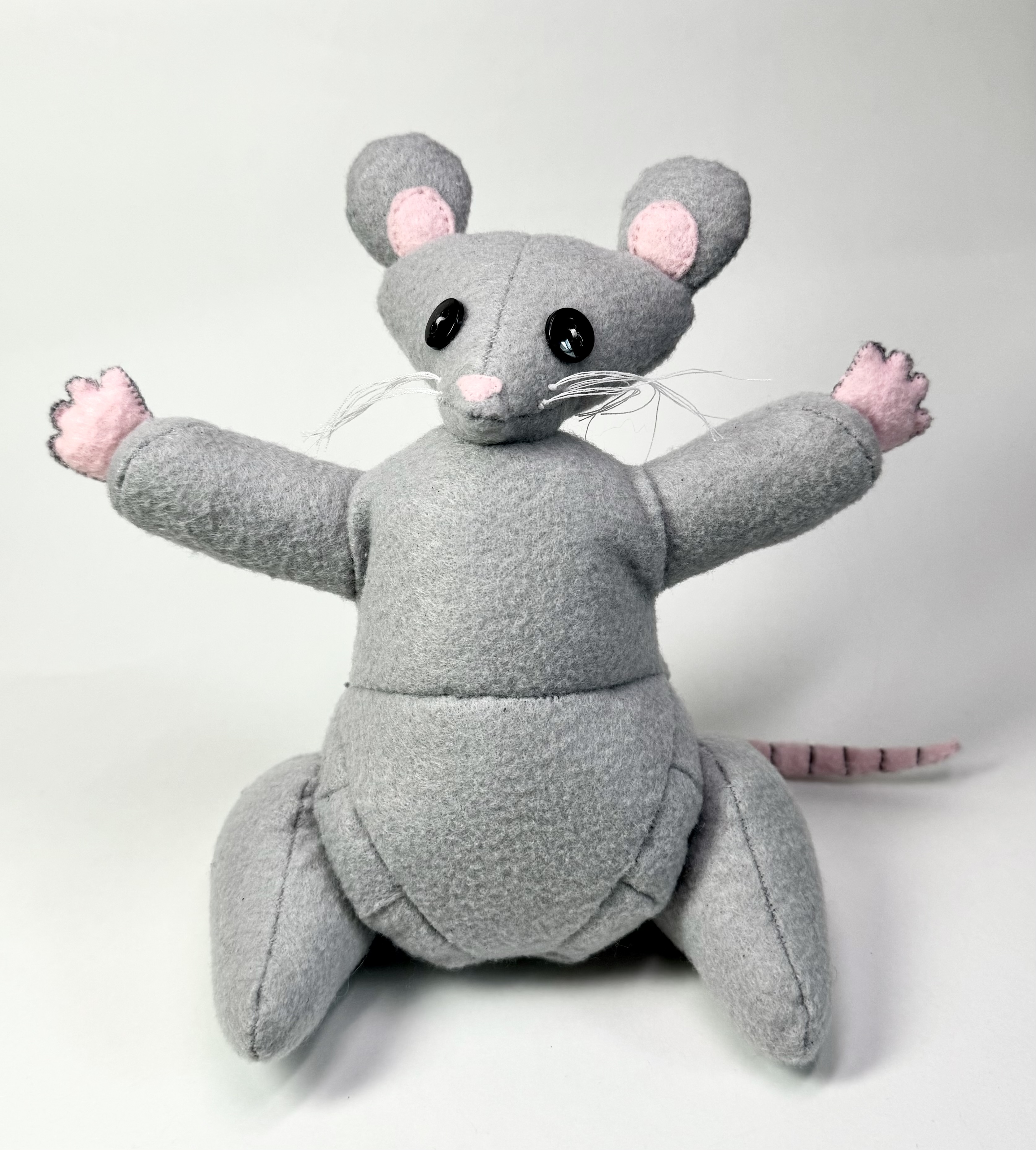 Front view of the Riggs the Rat stuffed animal