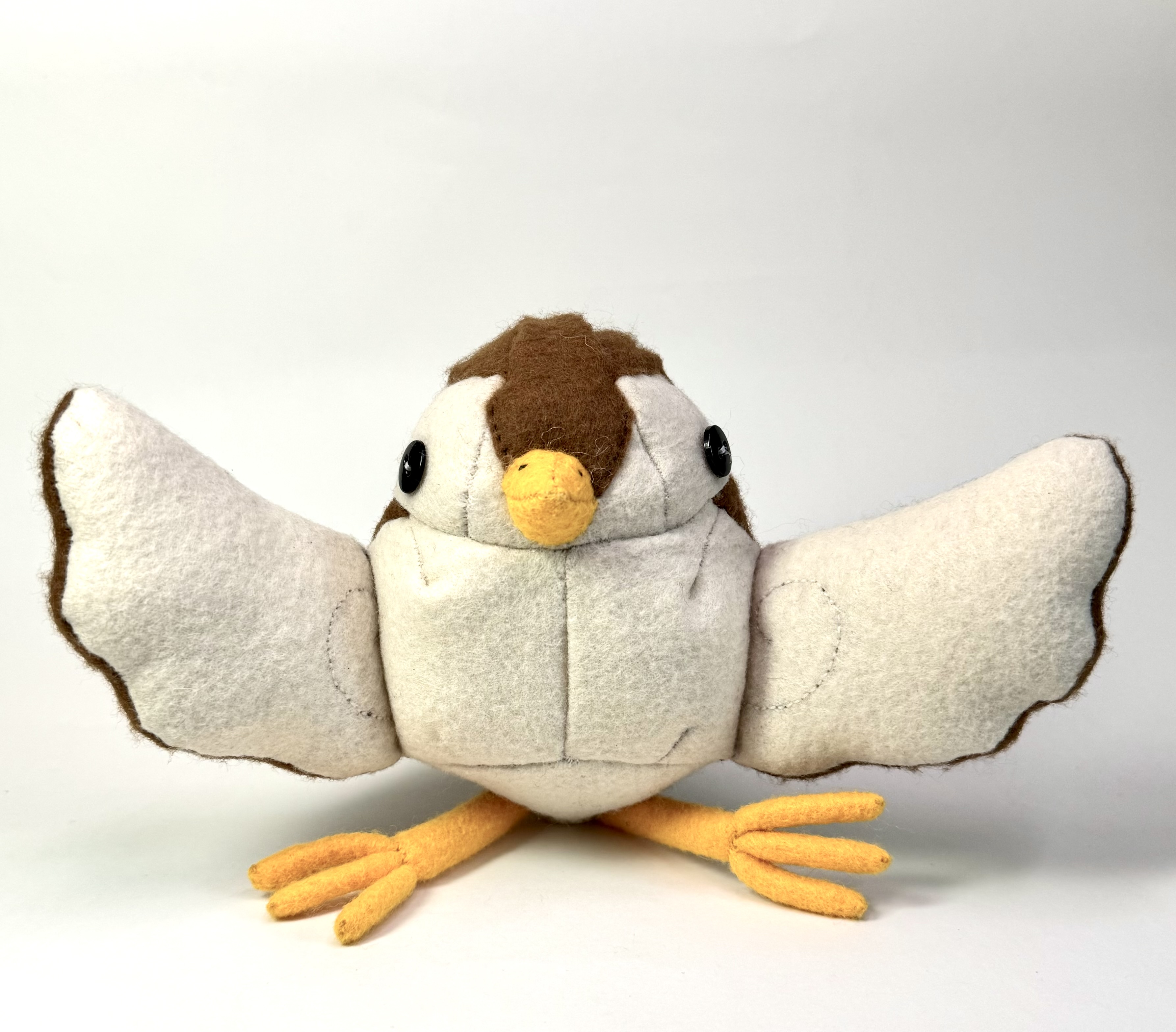 Front view of the Sibella the sparrow stuffed animal