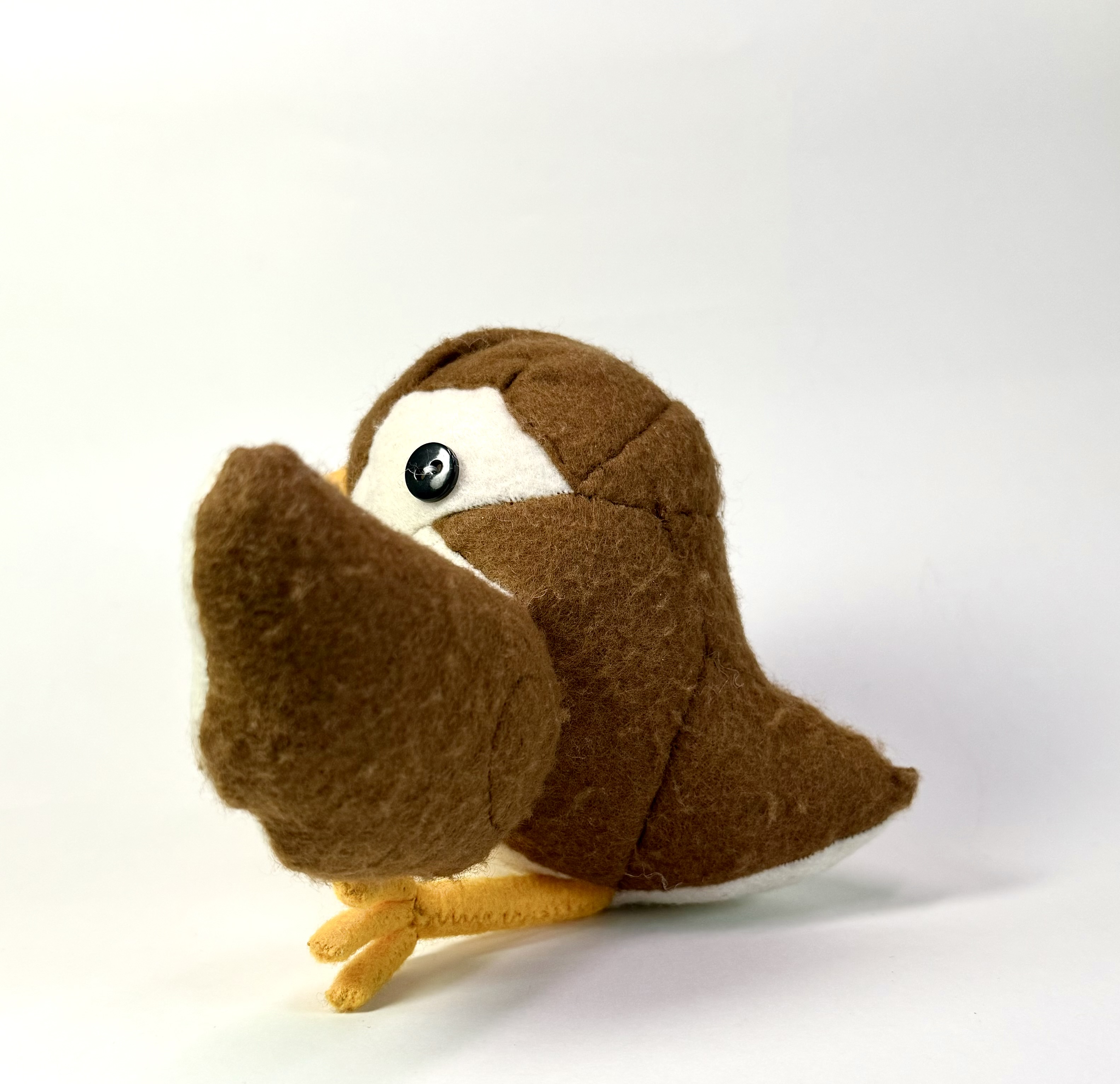 Left view of the Sibella the sparrow stuffed animal